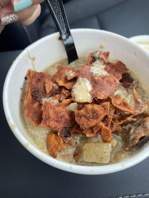 Cup of clam chowder with bacon bits sprinkled on top  at Love It Vegan  in Torrington