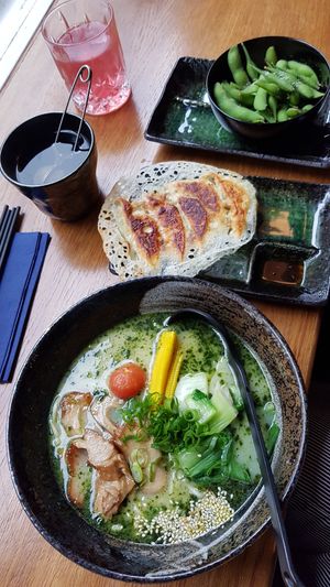 Basil ramen, crispy gyoza, edamame, genmaicha tea & pomegranate aloe juice at Iimori Vegan Ramen  in Berlin