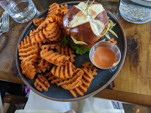 Lentils Kindness burger with sweet potato waffle fries at The Ginger Mule in Houston