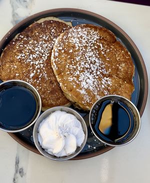 Gluten-free Pancakes with extra syrup and whipped cream!  at The Ginger Mule in Houston