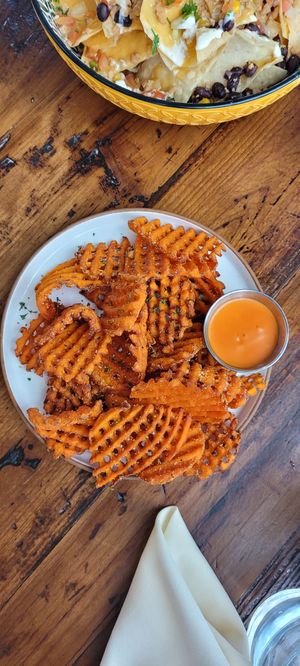Waffle fries + delicious sauce at The Ginger Mule in Houston