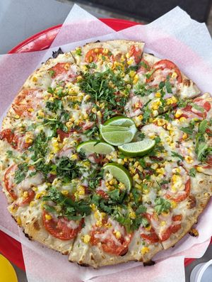 Pizza of the day with tomatoes, corn, vegan cheese at Sliver Pizzeria   in Lafayette