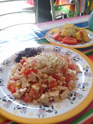 Tofu a la mexicana incluye plato de fruta con granola at Chamaca Vegana in Mexico City
