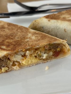 Breakfast burrito with just egg, hash brown, and vegan cheese and sausage.  at January Coffee in Boulder