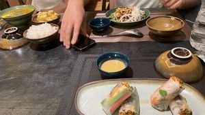 Spring rolls, black garlic noodles and a curry. All very delicious !   at Green Inn - Nhà hàng thuần chay in Hanoi