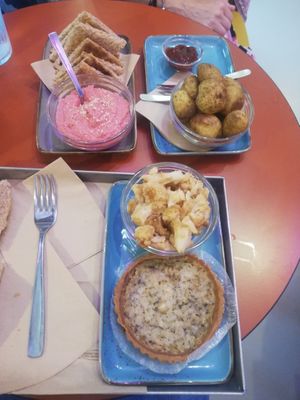 Hummus with beetroot, wild potatoes with barbecue sauce, salty rice cake, cauliflower. at Flora et Labora in Milan