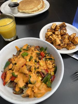 Bionic breakfast with a side of tofu cubes. Pictured behind is the short stack (vegetarian, but not vegan) and some OJ!   at Ria's Bluebird in Atlanta