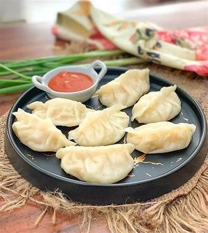 Veg momos are steamed dumplings, typically filled with a mixture of finely chopped vegetables and spices. at Jagdish Farshan in Irving
