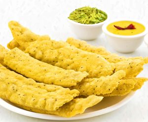 Fafda is a popular Gujarati snack made from gram flour dough that is rolled out into thin strips, deep-fried until crispy. at Jagdish Farshan in Irving
