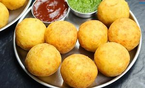 Surti Patties are a famous Gujarati street food snack consisting of crispy puff pastry stuffed with a savory filling of mashed potatoes, peas, and spices. at Jagdish Farshan in Irving
