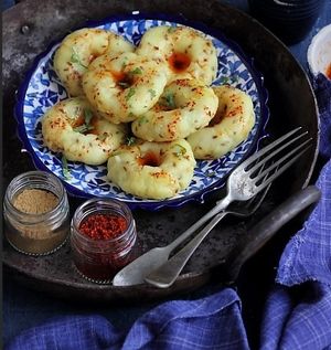 Khichu is a popular Gujarati snack made with rice flour, cumin, and green chili, boiled in water, and then flavored with oil, garlic, and sesame seeds. at Jagdish Farshan in Irving