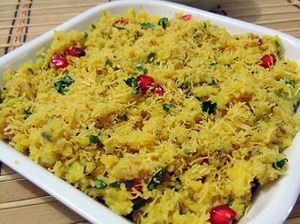 Sev Khamani is a popular Gujarati snack made with crumbled and tempered dhokla, topped with sev, onions, and chutney. at Jagdish Farshan in Irving