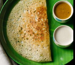 Rava Dosa, a thin and crispy crepe made from rava, rice flour, semolina and cumin. Served with sambar, coconut and tomato chutney. at Jagdish Farshan in Irving