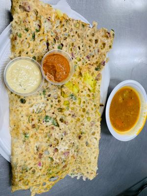 Rava Masala dosa, a thin and crispy crepe made from rava and rice flour, potato masala and served sambar, coconut and tomato chutney. at Jagdish Farshan in Irving