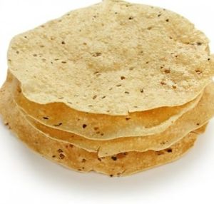 Papad is a thin, crispy Indian wafer made from lentil, chickpea, or rice flour that is usually served as an accompaniment to meals or as a snack. at Jagdish Farshan in Irving