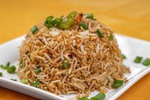 Schezwan fried rice is a spicy and flavorful Indo-Chinese dish made with cooked rice, mixed vegetables, and a hot and tangy Schezwan sauce. at Jagdish Farshan in Irving