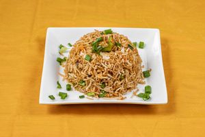 Vegetable fried rice is a delicious Asian dish that combines cooked rice, mixed vegetables, and stir-fried with soy sauce and other seasonings. at Jagdish Farshan in Irving