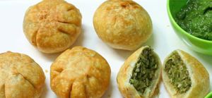 Lilva kachori is a deep-fried Indian snack made with a crispy pastry shell and a filling of spiced pigeon peas. at Jagdish Farshan in Irving