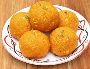 Motichoor ladoo is a popular Indian sweet made with tiny fried balls of chickpea flour, which are then shaped into round balls and coated with sugar syrup. at Jagdish Farshan in Irving