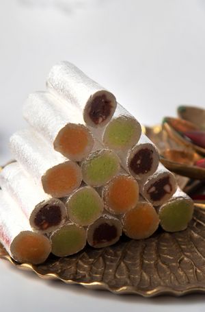 Kesar roll is a traditional Indian dessert made with a mixture of sweetened khoya (milk solids) and saffron, rolled into a log and garnished with chopped nuts. at Jagdish Farshan in Irving