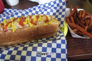 Vegan Chicken Dog with saurkraut and rosted garlic. Sweet potato fries at Dreamy Weenies in New Orleans
