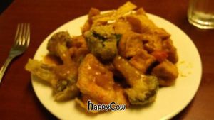 This picture doesn't do the food justice. What's shown is tempura, garlic tofu (excellent sauce), and fried noodles. SO GOOD!  at Vegetarian House in Portland