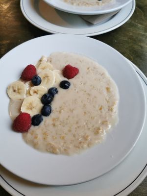 Bowl of porridge with almond milk and some fruit, paid 7,5 pounds for this which is a little expensive if you ask me. at Organic Deli Cafe in Oxford