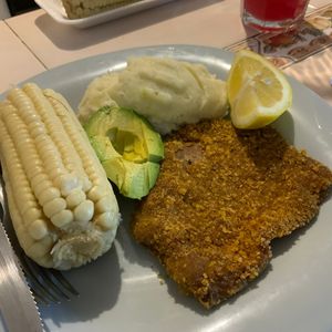 Milanesas with smashed potatoes and buttered corn at Vegan Chefcita Homemade Foods in Puerto Vallarta