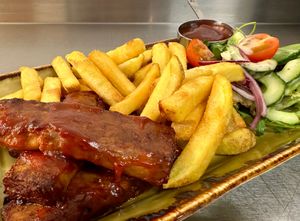 Vegan Ribs with BBQ Sauce, Chips and Dressed Side Salad at Tonnau Restaurant in Criccieth