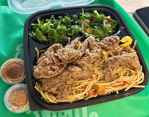 Burdock root stir fry with fried oyster mushrooms and salad.  at Food For Negus in Brooklyn