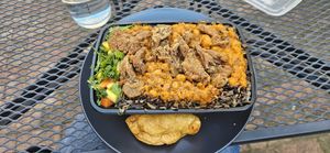 Huge meal!!!! and tiny empanada wgich costs 1/3 of the meal at Food For Negus in Brooklyn