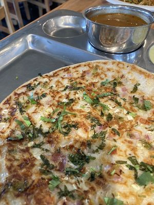 Uttapan. Rice lentil pancake with vegetables  at Honest Restaurant Cleveland in Parma Heights