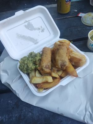 Chips and sausages at Village Fish & Chip Shop in Manchester