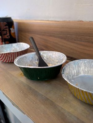 Finished pies. Green one in the middle is from the wrongly served VEGETARIAN cheese, onion and potato pie. Other two colours are vegan. at Village Fish & Chip Shop in Manchester