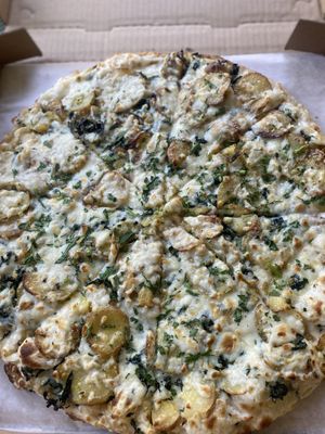 Pizza of the Day: ROASTED YUKON GOLD POTATOES, DINO KALE, VEGAN CHEESE, FRESH HERBS AND GARLIC OLIVE OIL 😛  at Sliver Pizzeria - Broadway in Oakland