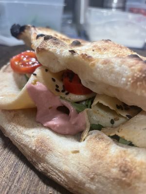 Vegan “conchiglia” - a pizza shell with various vegan toppings (vegetables, veg cold cuts and vegan cheese)  at Zia Pizza in Peschiera Del Garda