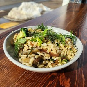 Roasted Eggplant, broccoli, fennel, and red onion served with orzo, fresh herbs, and citrus-fennel dressing. at 3rd & Vine in Eau Claire