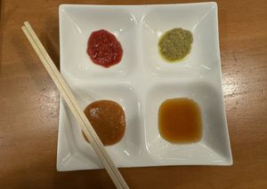 Different sauces for gyoza .  at Champagne and Gyoza Bar - Minota in Tokyo