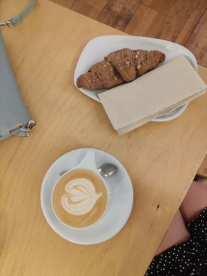 Oat cappucino and vegan croissant at My Little Melbourne in Budapest