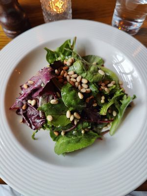 Leafy salad with pine nuts on a bed of avocado and sun-dried tomatoes at Bouchon in Naas