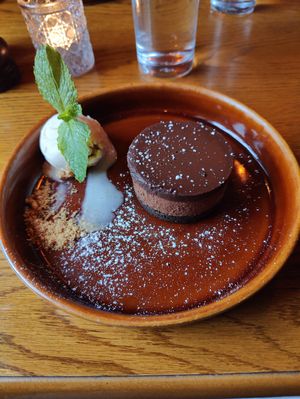 Triple chocolate (cookie bottom, chocolate mousse and chocolate cream) dessert with vanilla ice cream at Bouchon in Naas