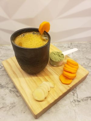 Sana shot: carrot | wheatgrass | ginger at Tierra Santa BCS - Collaborative Coffee Shop in Todos Santos