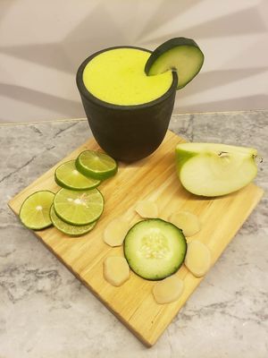 Detox shot: green apple | cucumber | ginger | estafiate tincture at Tierra Santa BCS - Collaborative Coffee Shop in Todos Santos