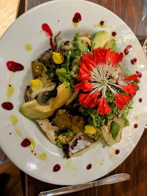 Charming husband & wife team serve organic food grown in their garden. Food and drinks all beautiful and cheap. The chocolate pumpkin bomb ordered by another table was spectacular! at Soq‘a in Cusco