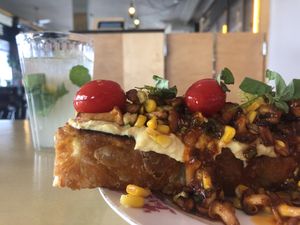 Focaccia with tempeh corn cream and chanterelles  at Lychees in Warsaw
