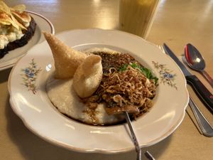 Congee with cashew butter, oyster mushrooms glazed in muscovado, salsa macha, salty
"faworki" , crispy shallots, soybean sprinkles  at Lychees in Warsaw