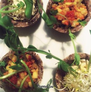 raw tarts with micro greens  at Tri in Kyiv