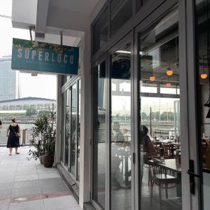 Outdoor signage   at Super Loco - Customs House in Central Singapore