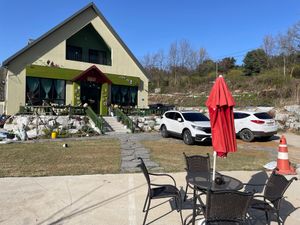 Café with outside seating area at Difference in Geumsan