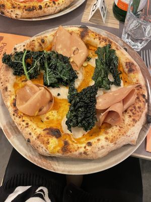 Pizza with pumpkin cream, vegan mozzarella and ham and kale chips  at Fratelli Panza in Udine